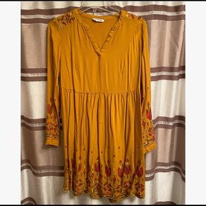 Gold long sleeve dress.